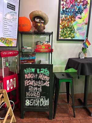 Interior, with board games and sign for late night menu  at Salad or Bust in Colorado Springs