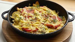 pan with potatoes, mushrooms and vegan cheese   at Ola Healthy Cafe in Khmelnytskyi