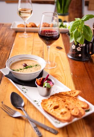 Crème de pois chiche méditerranéenne aux olives kalamata, légumes marinés et croûtons. at Il Bazzali in Montreal