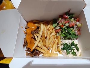 Hempeat with fries, hummus and Izraeli salad at Tel Aviv Urban Food - Zgrupowania in Warsaw