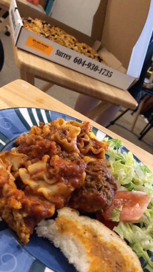 Lasagne, garlic bread  at Vegan Pizza House in Vancouver