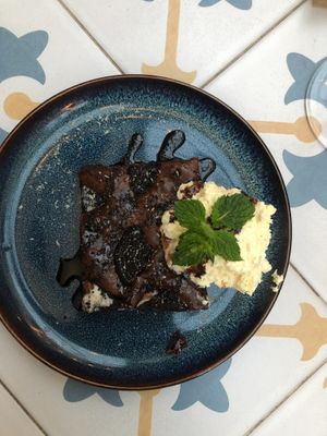 Warm chocolate brownie with vegan cream at Fala Fala in Funchal