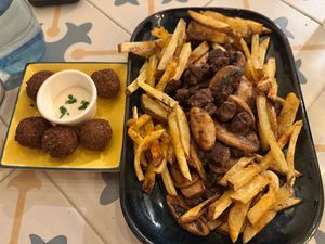 Great local dish like 'dirty fries' at Fala Fala in Funchal