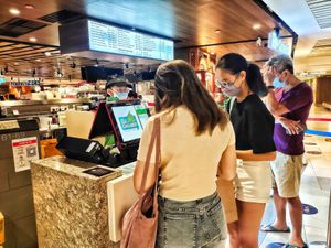 Queueing at Mr Coconut - Raffles Place in Central Singapore