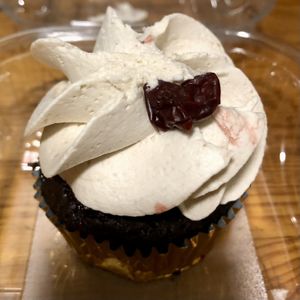 Black Forest cupcake…squished icing is my fault 🤣 at Caked Coffee in Toronto