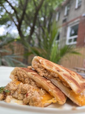 Scrambled tofu in a naan bread, with cheese  at Caked Coffee in Toronto