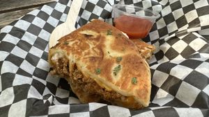 Bibi: scrambled tofu in cheezy naann  at Caked Coffee in Toronto