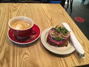 Almond milk latte and avocado toast at News Bar Cafe in New York City