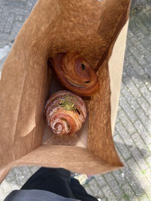Pistachio cruffin (bottom) and pain au chocolat (top)  at Saint-Jean in Amsterdam