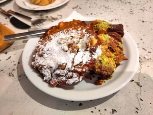 Stuffed and topped croissant and pain au chocolat with pistachios, almonds and hazelnuts at Saint-Jean in Amsterdam