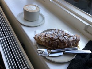 Cappuccino with oat milk and almond croissant   at Saint-Jean in Amsterdam