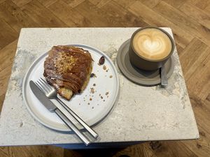 Chocolate & Hazel nut croissant and latte with pea milk.   at Saint-Jean in Amsterdam