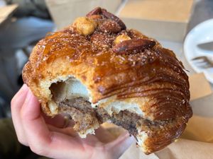 Croissant with a really delicious hazelnut paste inside, topped with candied nuts at Saint-Jean in Amsterdam