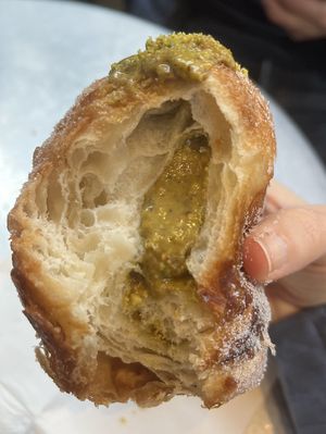 Interior of pistachio cruffin  at Saint-Jean in Amsterdam