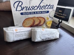 Crackers and two sample cheeses from the shop   at Cultured Kindness Vegan Cheese Shop in Portland