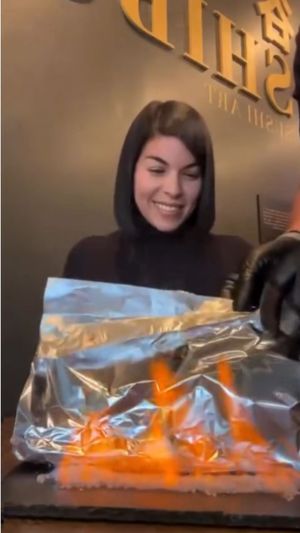 NEW Plant Flame Roll (in this picture on fire):
Scallions, Onions rings, Tofu tempurized, Palm Heart, Avocado & house vegan cream. Choose Teriyaki or Troffel oil. at Shibuya Sushi Art - Weston in Weston