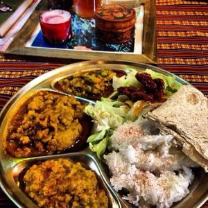 The three curry dish with rice, bread and salad at Himalaya Vegetarian Cafe in Edinburgh