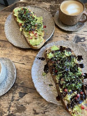 Oat milk cappuccinos with avocado toasts  at Honest Greens - Tuset in Barcelona