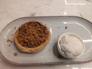 Biscoff apple crumble tart with vegan vanilla ice cream at Heavenly Desserts - Cambridge in Cambridge