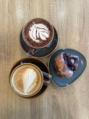 Oat latte, hot chocolate, berry cinnamon bun  at Fika in Bournemouth
