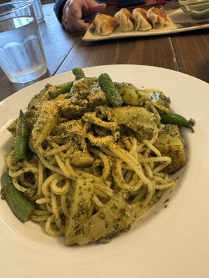 Pasta Cabrera and some potstickers in the background   at Gajimaru in Okinawa
