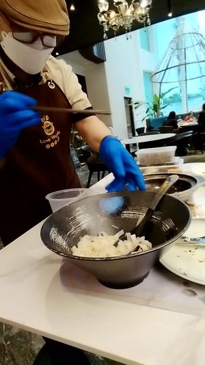Tam prepares my "takeaway" right at the table at Love Veggie Macau in Macau