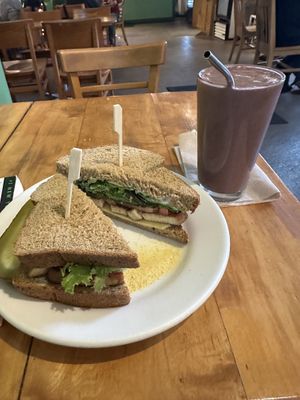 Roasted Tofu Sandwich + Cherry Garcia smoothie w/ chocolate protein powder (tofu is PERFECTLY marinated & smoothie is awesome - not too sweet)  at Wild Chestnut Cafe in Florence