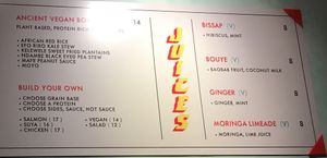 Wall menu listing some of the vegan items at Teranga - Midtown in New York City