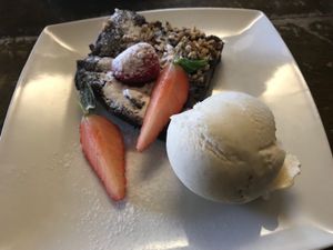 Chocolate brownie and ice cream (vegan)  at Cafe Roya in Beeston