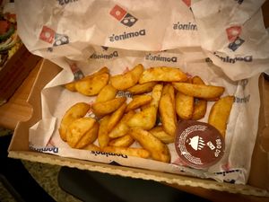 Vegan potato wedges and vegan dipping sauce at Domino's Pizza in Athens