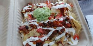 Large Vegan Nachos with sour cream and guac at Red Emma's Bookstore Coffeehouse in Baltimore