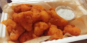 Vegan Buffalo Cauliflower Wings and vegan ranch at Red Emma's Bookstore Coffeehouse in Baltimore