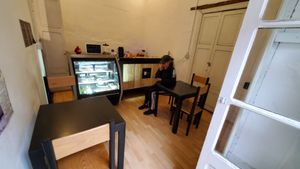 Two tables inside and one outside. at La Mandioka in Toluca