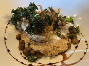 Celeriac steak with roasted chickpea hummus and crispy kale  at The Bear Hotel in Cowbridge