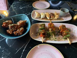 Cauliflower bites, plant based gyozas, bbq tofu bites   at Vegan Pind in Staines-upon-thames