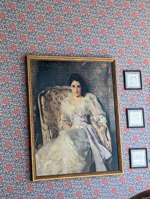 Painting matching wall paper at Felix Roasting Co in Aspen