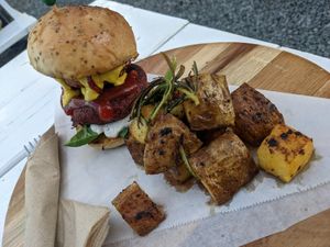 Burger and roasted rosemary potatoes. at Arte Sano in Aguadilla