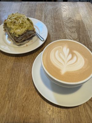 Oat latte and pistachio cinnamon bun  at Ministerstwo Kawy in Warsaw
