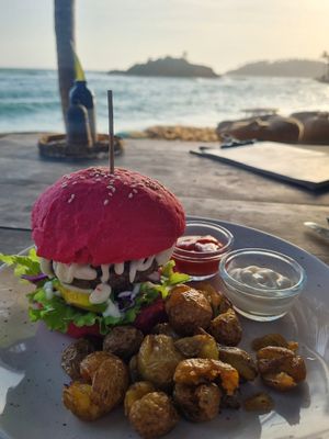 Burger the classic kidney beans, mushrooms, walnut and oat on fresh lettuce, avocado, tomato and onion, beetroot bun and topped with homemmade mayonnaise and secret sauce 3520~10 at THE SLOW in Mirissa