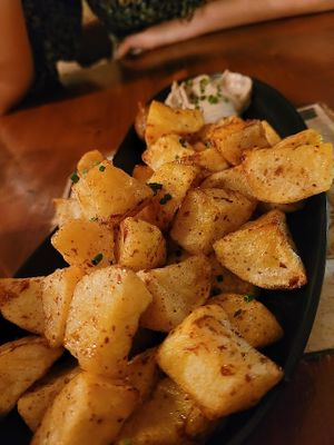 Patatas bravas. Could have been crispier, but nice. Came with a good garlic mayo and very spicy tomato sauce. at Ziryab in Barcelona