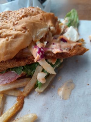 Here is the mess of a sandwich with the 2mm shoe leather "patty" square like shoe leather with the white uncooked fries at The Vegan Chef - Sandton in Johannesburg