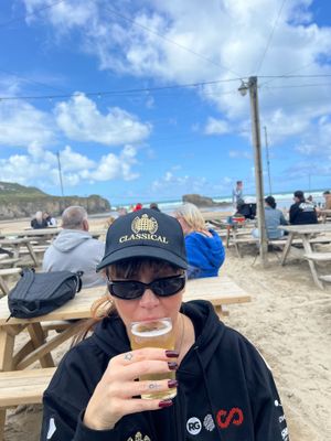 Drinking Cornish cider on the beach, what’s better than this? at The Watering Hole in Perranporth
