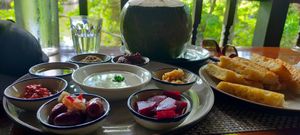 Vegan Mezza plate and fresh coconut drink. at Yoga House in Koh Phangan