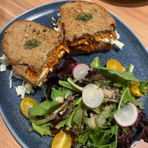 Delicious grilled cheese sandwich! Generous portion of kimchi but it kinda overpowers the cheese. Huge portion of salad on the side!  at Am I Addicted in Central Singapore