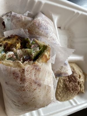 Falafel wrap with side of hummus   at Umami Global Bistro in Catonsville