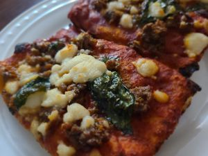 Vegan Fennel Sausage pizza with basil at Emma Hearth & Market in Bridgman
