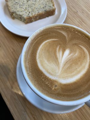 Soy latte & an already nibbled To Live For lemon loaf (by me, haha!) 😋  at Milano in Victoria