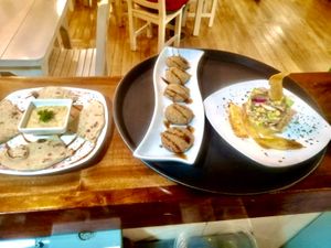 Baba ganoush with pita bread, Mushrooms stuffed with mozzarella, breaded with panko and mushroom ceviche with green banana slides . at Serendipia Encuentro in Salento