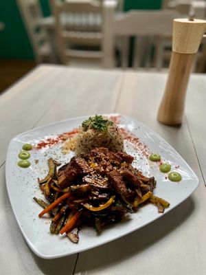 WOK VEGETABLES, Mushroom mix and vegetables mix,Flavored with olive oil and ginger. Garnished with toasted sesame seeds. Accompanied with a portion of ancestral rice.  at Serendipia Encuentro in Salento