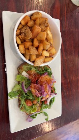 Avocado toast with no egg and breakfast potatoes   at Brick & Spoon in Pigeon Forge